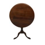 A GEORGIAN MAHOGANY TILT TOP SUPPER TABLEthe Circular top raised on a turned column with three