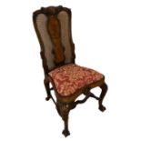 A QUEEN ANNE DESIGN WALNUT CHAIRwith vase and cane solar back above floral upholstered drop in