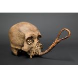 A 19TH CENTURY DAYAK TRIBE HEADHUNTERS TROPHY HUMAN SKULL.