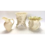 BELLEEK, A SELECTION OF PORCELAIN ITEMS To include a miniature jug and two vases, all bearing a