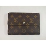 LOUIS VUITTON, A VINTAGE BROWN LEATHER PORTE TRESOR ETUI WALLET With gilt monogram design and