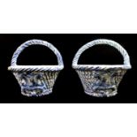 A PAIR OF DELFT STYLE BLUE AND WHITE PORCELAIN WALL BASKETS With cross-hatched decoration centered
