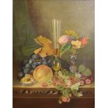 AN EARLY 20TH CENTURY OIL ON CANVAS Still life, a vase and tazza with fruit, signed lower right ‘