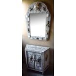 IN THE MANNER OF ANTHONY REDMILE, A TWO DOOR SIDE CABINET ADORNED WITH SHELS AND A MIRROR Along with