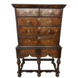A WILLIAM AND MARY PERIOD BURR AND STRAIGHT WALNUT CHEST ON STANDwith an arrangement of four short