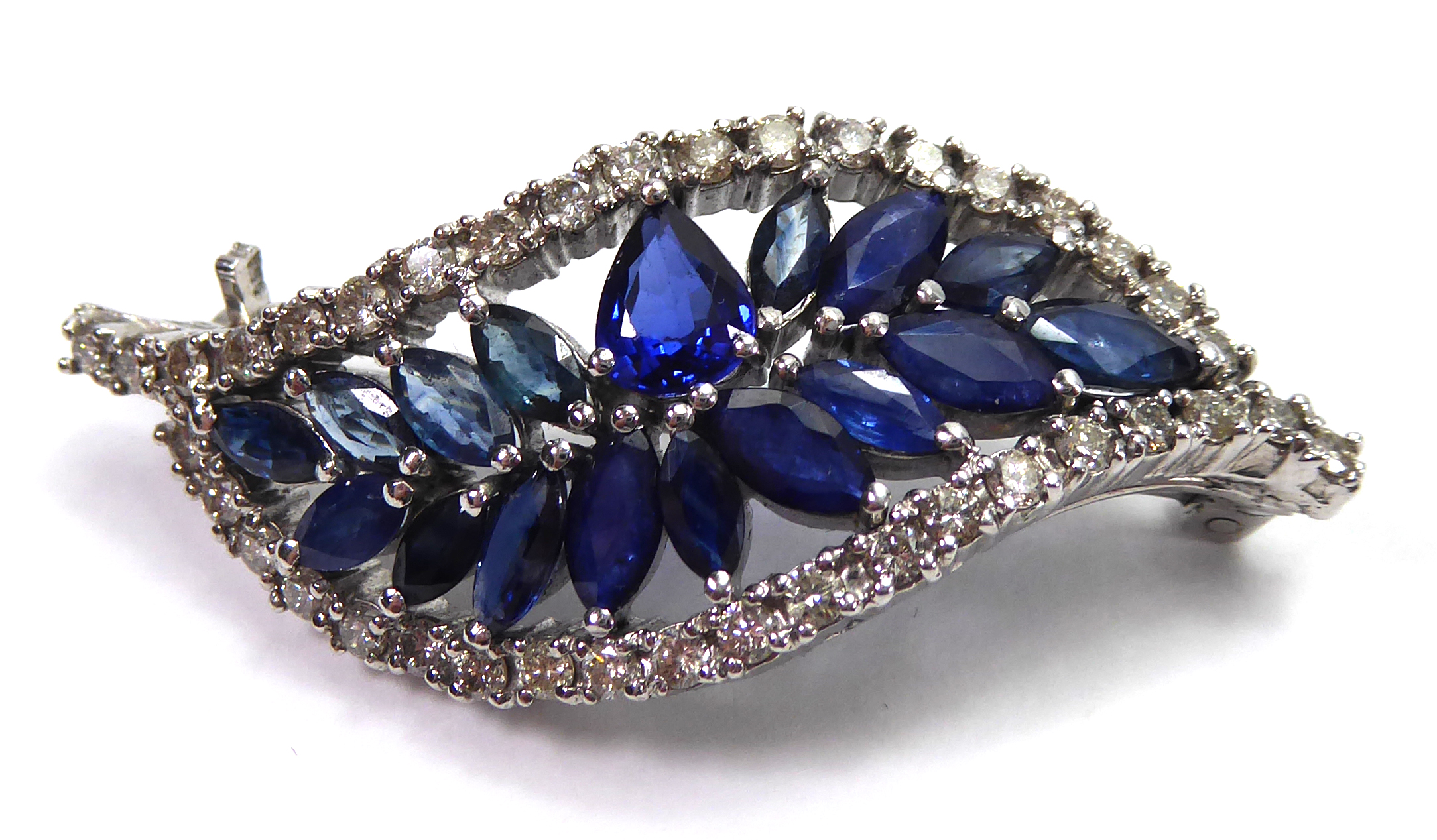 A SAPPHIRE AND DIAMOND LEAF BROOCH Set in white gold. (11.9g)