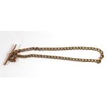 A VICTORIAN 9CT ROSE GOLD DOUBLE ALBERT CHAIN Having a dog clip and T bar. (approx 24cm)