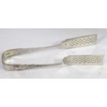 A PAIR OF VICTORIAN SILVER ASPARAGUS SERVERS Having scrolled decoration with pierced frame. (