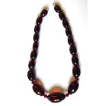 A VINTAGE CHERRY BAKELITE NECKLACE. (41cm)