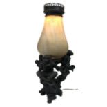 A LARGE CAST BRONZE TABLE LAMP Figured with three monkeys and faux stone shade. (72cm x 36cm)