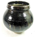 A DAVID LEACH ART POTTERY VASE Having a treacle glaze and bearing monogram stamp to base. (approx