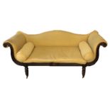 A 19TH CENTURY REGENCY PAINTED AND UPHOLSTERED SOFA With shaped back over scrolling arms, raised