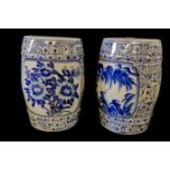A PAIR OF CHINESE BLUE AND WHITE DRUM STOOLS Decorated with foliage and pagodas in a landscape. (