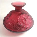 LALIQUE, AN IRIDESCENT RUBY GLASS ONION FORM SCENT BOTTLE With facial masks and fern leaves, signed.