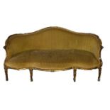 IN THE MANNER OF THOMAS CHIPPENDALE, AN 18TH CENTURY GEORGE III CARVED GILTWOOD SERPENTINE SETTEE