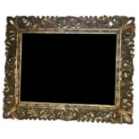 A GOOD 19TH CENTURY CARVED GILTWOOD MIRRORThe frame with scrolling motifs centered by a mercury