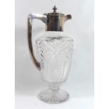 AN EARLY 20TH CENTURY SILVER PLATED CLARET JUG Shouldered form with cut glass decoration. (h 29cm)