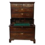 AN 18TH CENTURY MAHOGANY CHEST ON CHEST With an arrangement of two short above five graduating