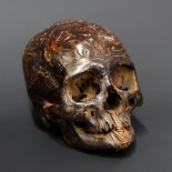 A 19TH CENTURY DAYAK TRIBE HEADHUNTERS CARVED TROPHY HUMAN SKULL.