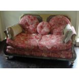 AN EARLY 20TH CENTURY GILT AND CHINOISERIE DECORATED BERGERE TWO SEAT SETTEE In pink floral