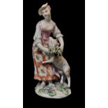 DERBY, A PORCELAIN FIGURE OF A SHEPHERDESS, CIRCA 1765 Placing a garland around the neck of a