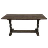 AN ANTIQUE OAK REFECTORY TABLEthe four plank top on two lyre end supports 168 x 82 x 76 cm