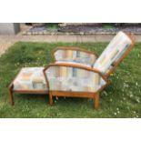 AN ART DECO PERIOD BEECHWOOD RECLINER With integral pull out stool, upholstered in a geometric