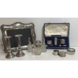 A COLLECTION OF ENGLISH SILVER To include a picture frame, cased three piece cruet with spoons,