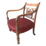 A VICTORIAN CHILD OPEN ARMCHAIR The pierced rail back inset with brass roundel and upholstered seat,