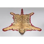 VAN INGEN MYSORE, AN EARLY 20TH CENTURY TAXIDERMY TIGER SKIN RUG WITH MOUNTED HEAD. Complete with