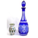 A VINTAGE BOHEMIAN GLASS ONION FORM DECANTER With overlaid blue glass cut with a diamond design,