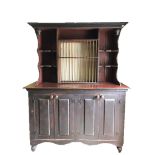A PAINTED PINE DRESSER OF VICTORIAN DESIGN With central plate rack flanked by open shelves above