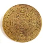 A GILT METAL MEDALLION Decorated with the Mayan calendar. (d 5.5cm)