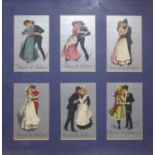 TWO SETS OF SIX EDWARDIAN POSTCARDS Courting couples with song sheets, framed and glazed. (approx