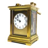 A 19TH CENTURY FRENCH GILT BRASS REPEATER CARRIAGE CLOCK Having a carry handle, four bevelled