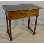 A 19TH CENTURY OAK AND PINE CLERK’S TABLE With a single drawer, raised on turned legs.