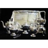 MIYAMOTO SHOKO, AN IMPRESSIVE EARLY 20TH CENTURY NINE PIECE SILVER TEASET To include tray, tea,