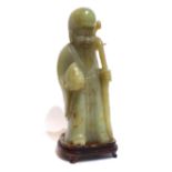 A CHINESE GREEN JADEITE STATUE Of a sage, on a hardwood stand. (28cm)