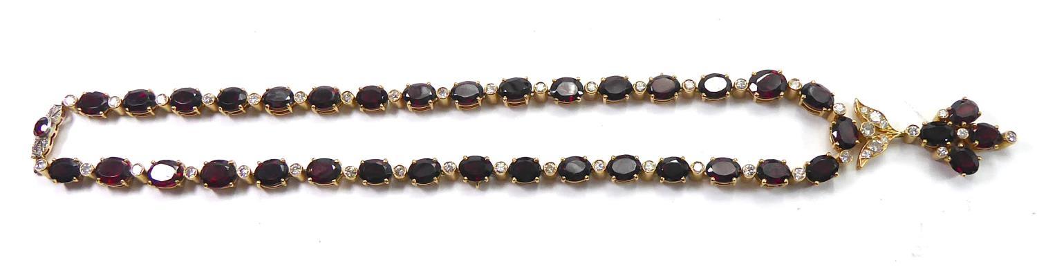 A GARNET AND DIAMOND ENCRUSTED NECKLACE AND MATCHING EARRINGS. (61.6g) - Image 17 of 23