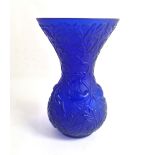 LALIQUE, AN IRIDESCENT BLUE GLASS FLARED NECKED VASE With swallows amongst foliage, signed. (13cm)