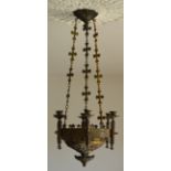 A GOTHIC BRASS SIX CANDLE CHANDLER With relief decoration, thistles. (90cm x 36cm)