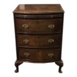 A MAHOGANY BOW FRONTED CHEST OF THREE DRAWERS WITH BRUSHING On squat cabriole legs. (52cm x 42cm x