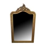 AN EARLY 20TH CENTURY GILT FRAMED OVERMANTEL MIRROR Rococo scrolled arched top with bevelled glass