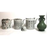 A CHINESE CANTON TEAPOT Along with two others decorated with script, a tea cup and a celadon