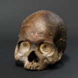 A 19TH CENTURY DAYAK TRIBE HEADHUNTERS CARVED TROPHY HUMAN SKULL.