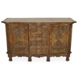 A 19TH CENTURY FRENCH FRUITWOOD SIDEBOARD With serpentine front and tooled leather top over an