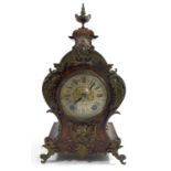 A 19TH CENTURY GERMAN WALNUT AND GILT BRONZE MANTLE CLOCK Scrolled case with figural bronze masks,