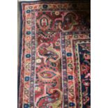 A LARGE TABRIZ RUG OF CARPET PROPORTIONS The central floral field contained within ten running