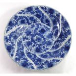 A 19TH CENTURY ORIENTAL BLUE AND WHITE DISH Having scrolled edge with floral decoration and Buddhist