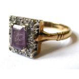 AN EDWARDIAN STYLE 9CT GOLD, AMETHYST AND DIAMOND DRESS RING The emerald cut amethyst claw set to
